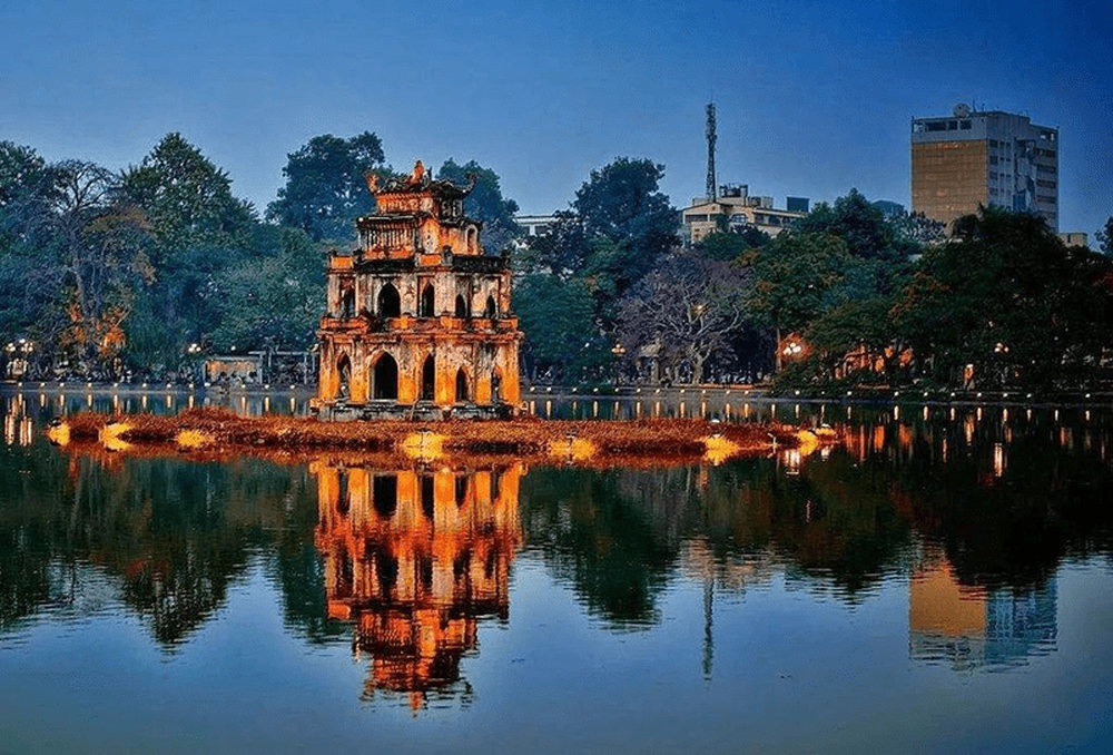Hoan Kiem Lake by night - with the iconic Thap Rua is a must-visit when you’re in Hanoi 